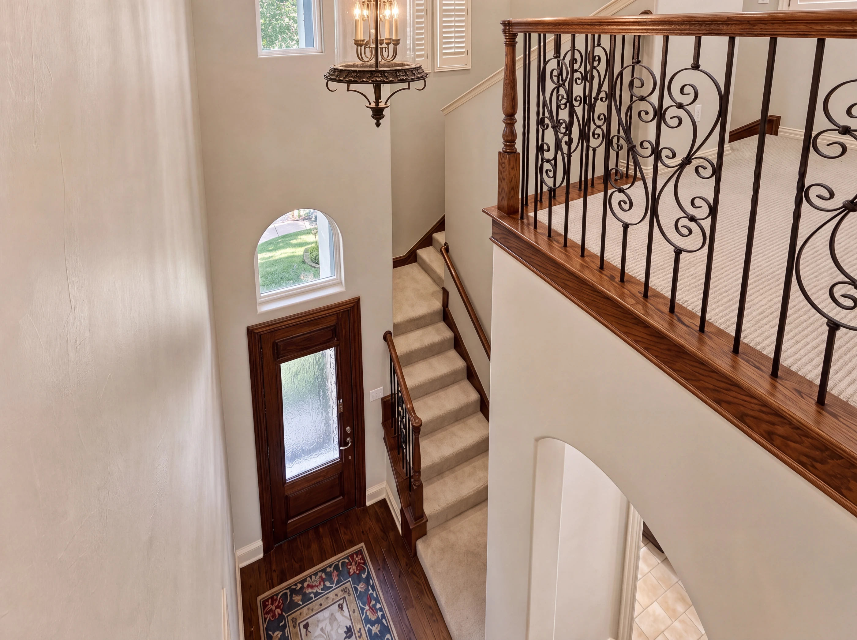 Looking down over the entry and wrought-iron stair
