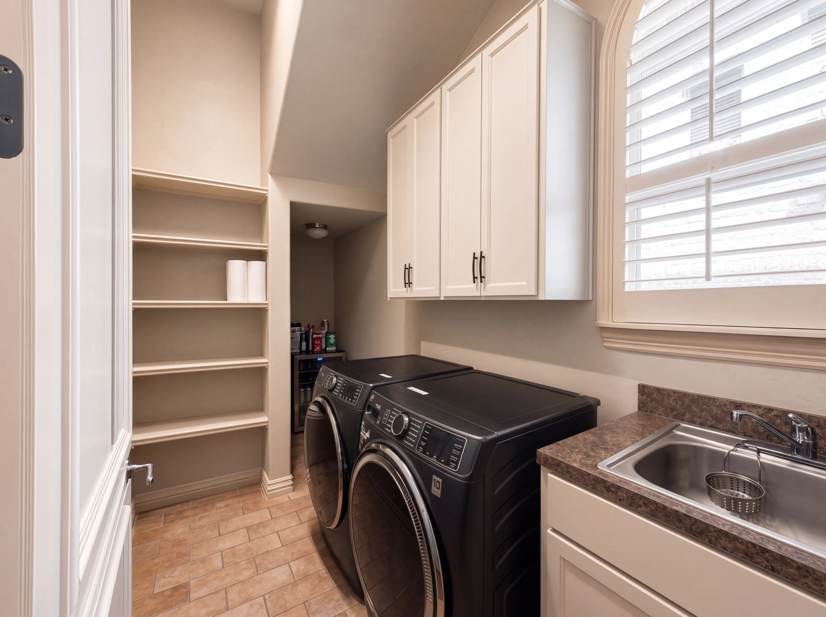 Utility room with built-ins and sink