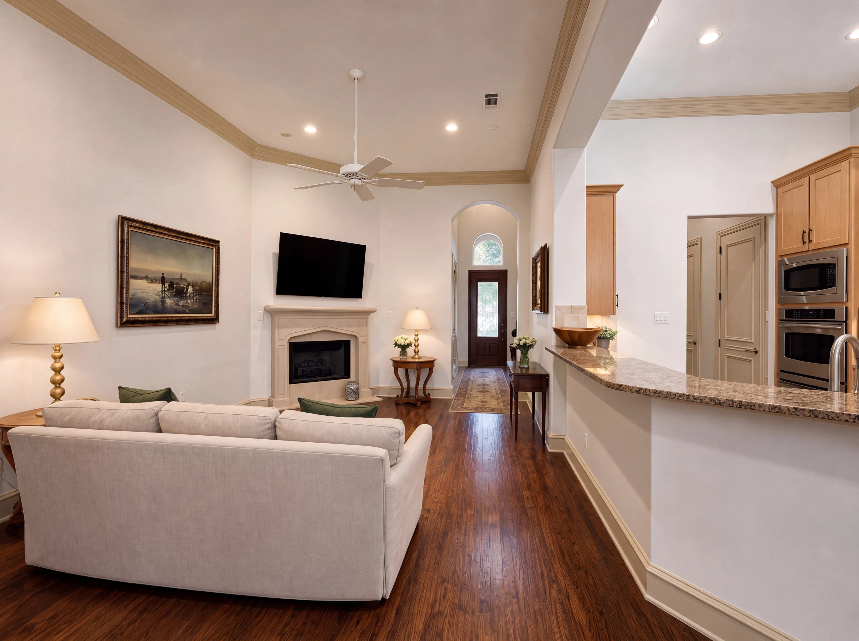 Living room with fireplace, open to the kitchen