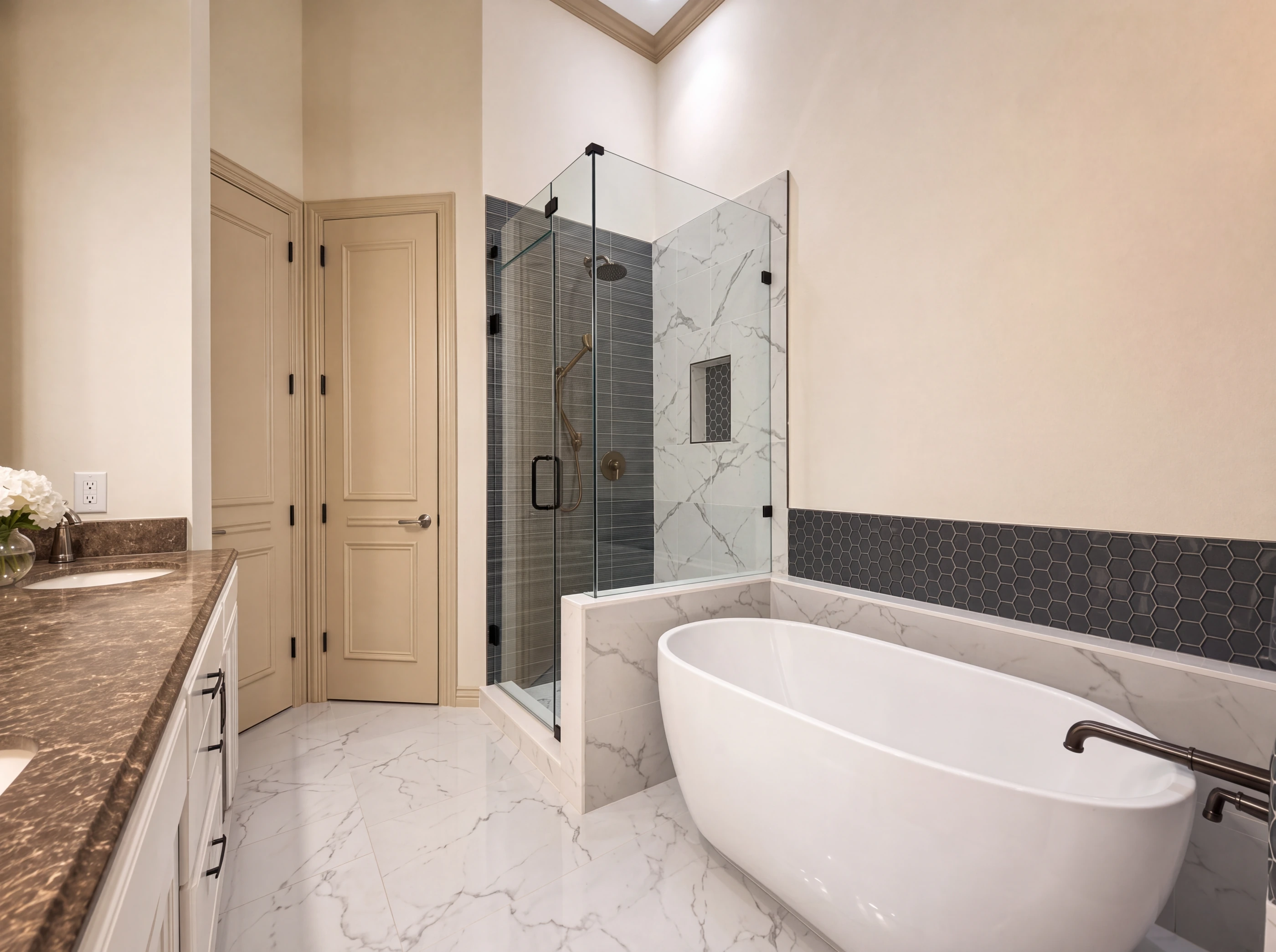 Updated primary bath with freestanding tub and frameless glass shower